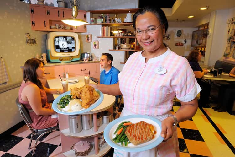 Disney's Hollywood Studios' best restaurants, woman holding plates of food