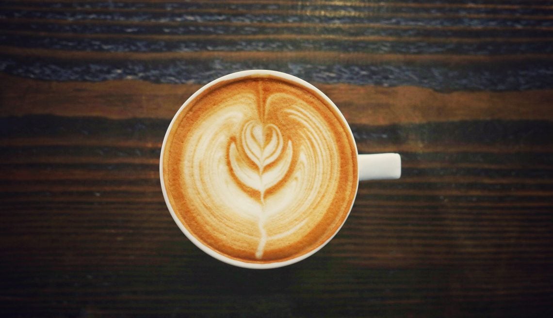 Top down image of flat white coffee with foam art