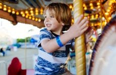 A young child on a carousel