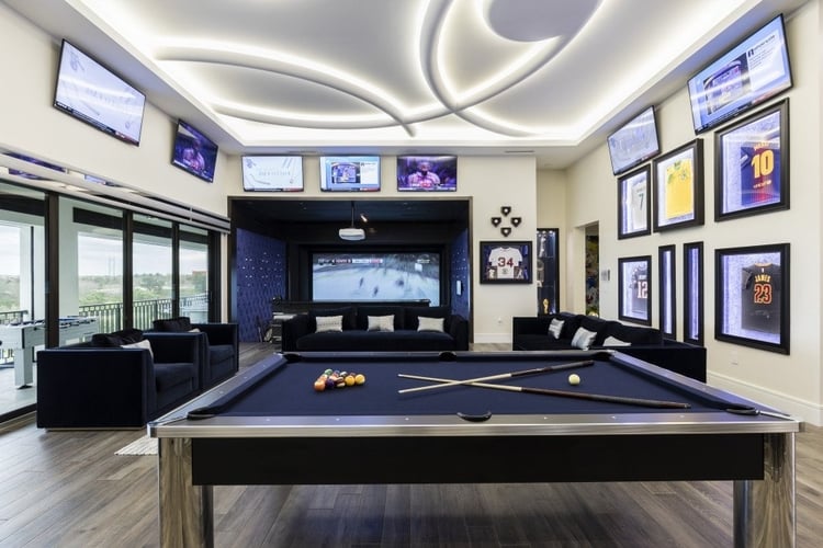 A modern game room with multiple televisions