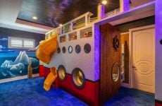 Reunion Resort 9000 cruise ship themed bedroom with bunkbeds and slide