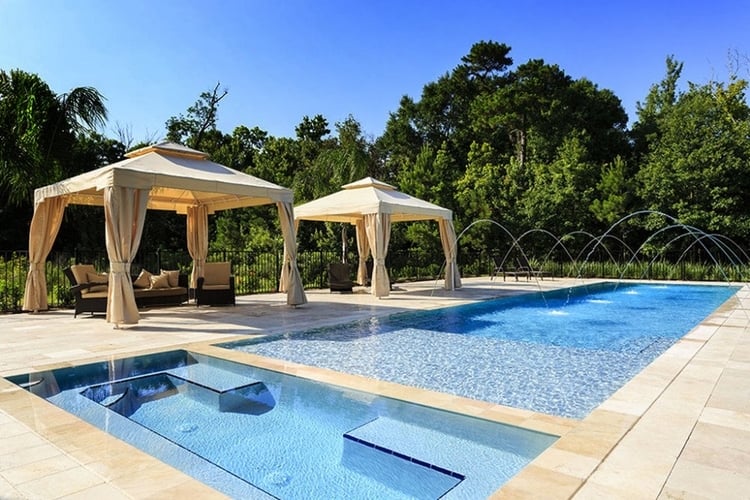 Vacation rental private pool with covered seating areas