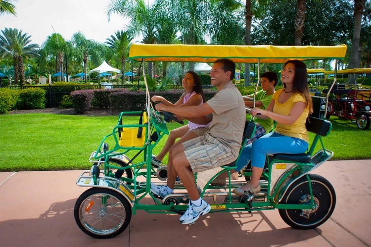 People on a golf buggy in Reunion Resort
