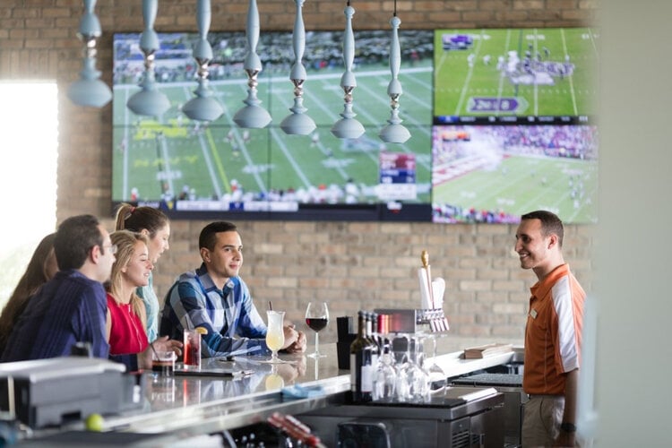 Guests enjoy drinks at the Shark Lounge bar at Encore Resort, Sports bar.