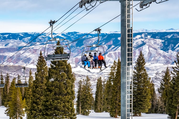 Skiiers heading upto Snowmass Colorado