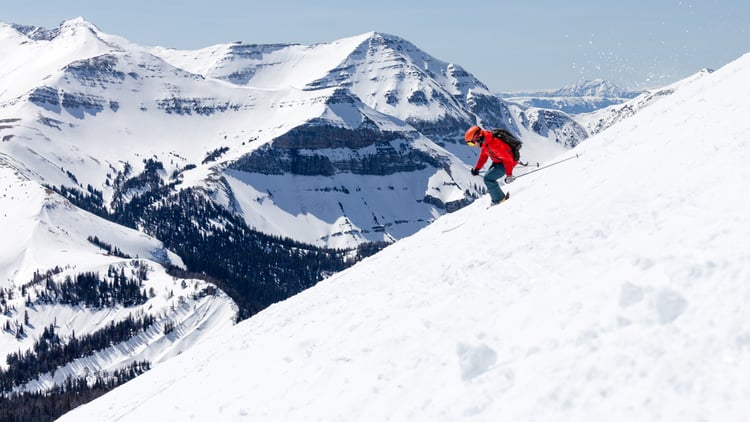 Skier heads down a slope in Big Sky Montana