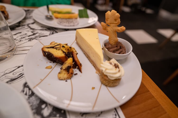 Desert plate with cheesecake slice, chocolate mousse and vanilla cake