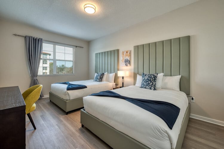 Orlando vacation rental bedroom with two double beds and desk