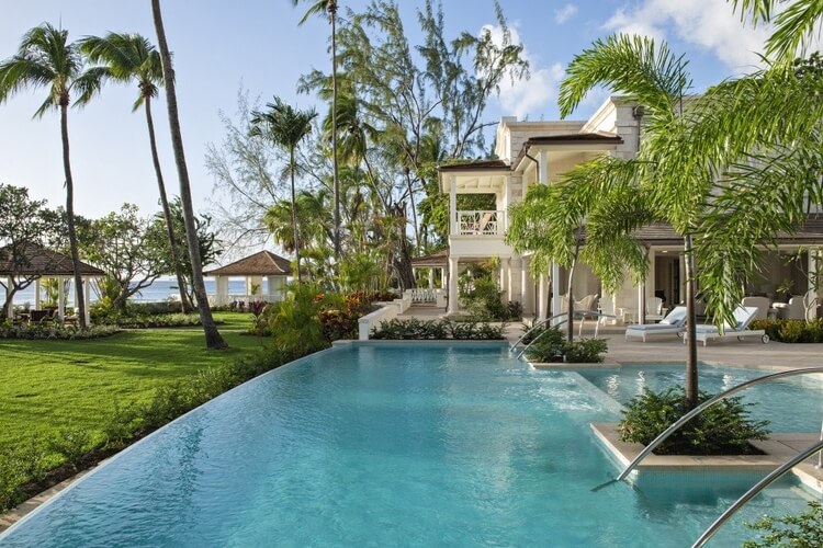 A luxury Barbados villa with palm trees and a large private pool
