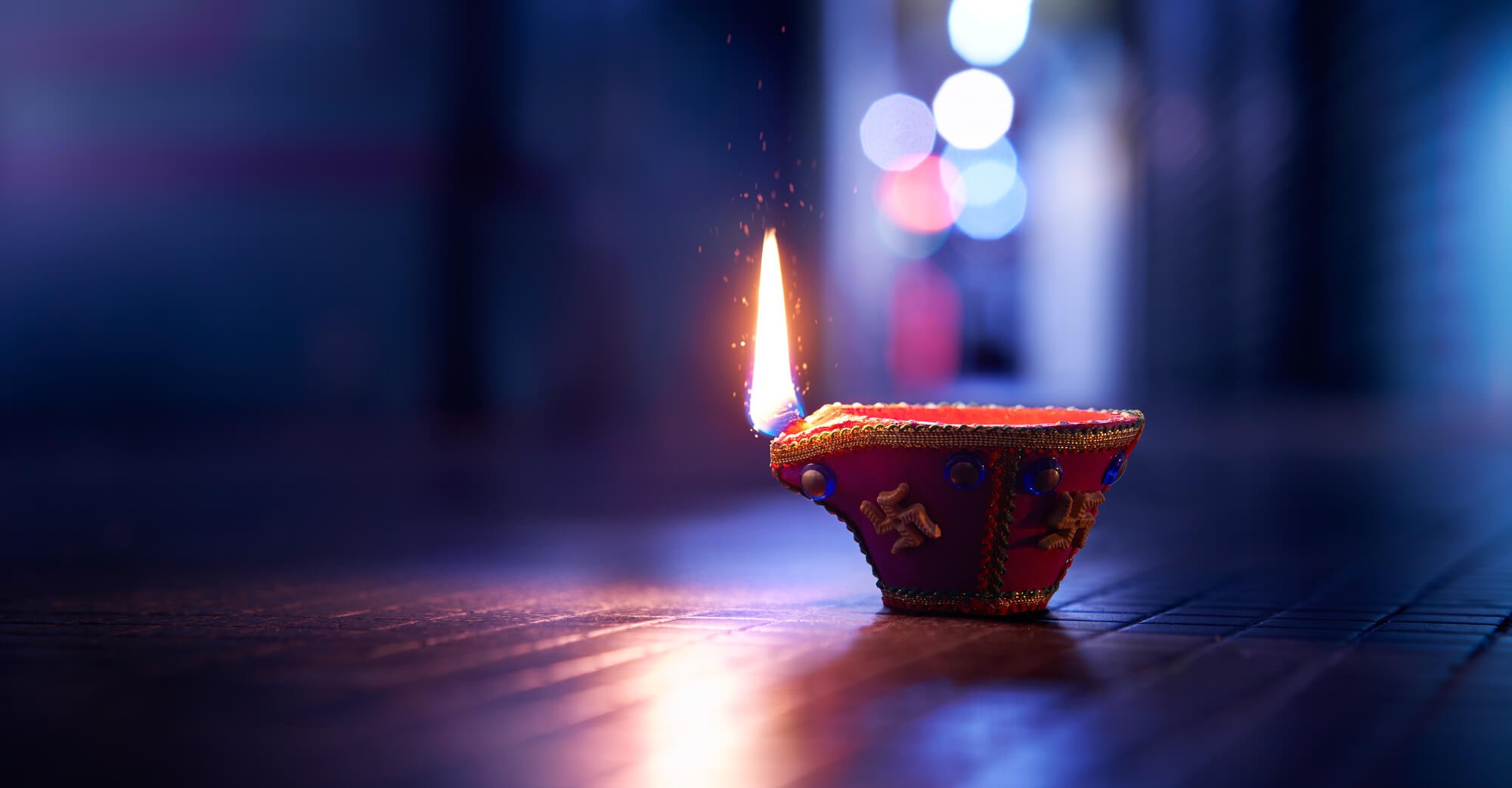 Vacation homes for Diwali image of Diwali candle on a table