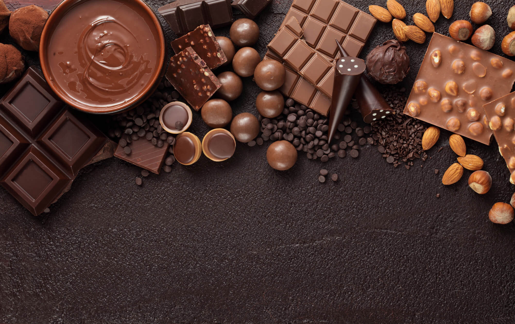 Assorted chocolate on a dark background