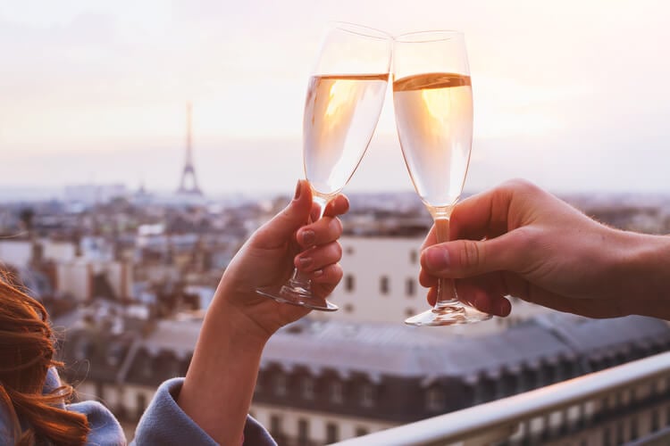 Two people with champagne glasses in Paris