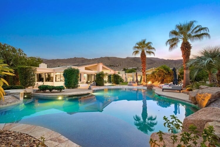 A spectacular Palm Desert villa with a large resort-style pool and mountain views