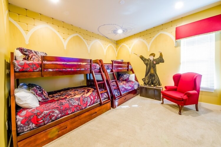 A yellow bedroom with Harry Potter decor