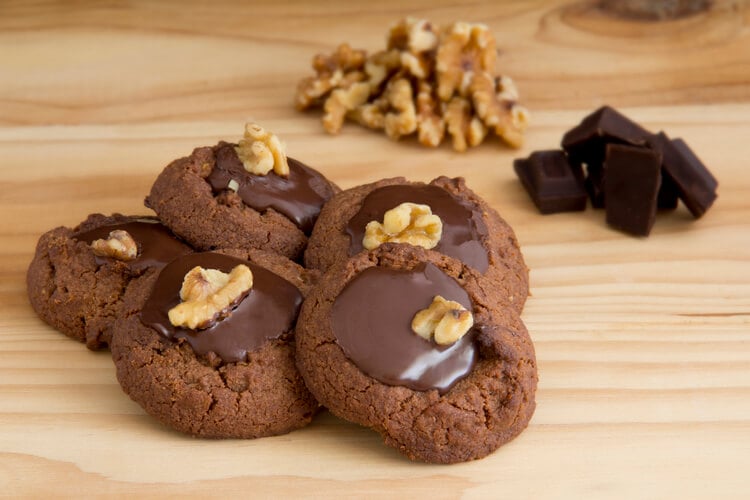 Afghan biscuits with chocolate icing and a walnut