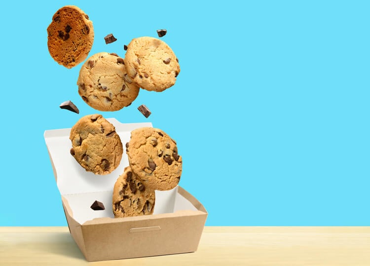 Chocolate chip cookies against a bright blue backdrop