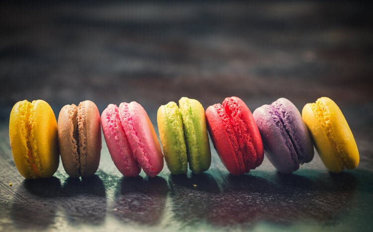 A row of colorful macarons