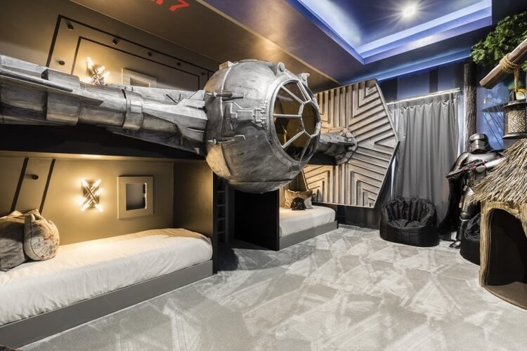 A Star Wars-inspired themed bedroom with a Tie Fighter bed