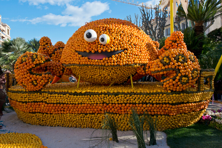 A carnival float made of oranges and lemons