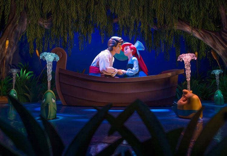 Guide to rides at Disney World - animatronic figures of Arial and Eric in a row boat on the Little Mermaid ride