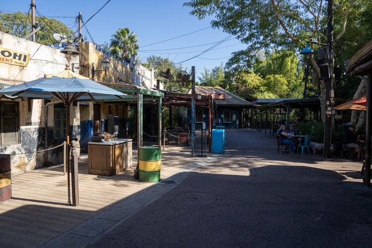 a photo showing the open air booths of harambe market in disney world