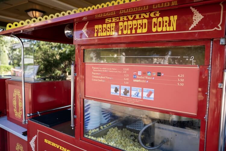 a bright red fresh popcorn serving station