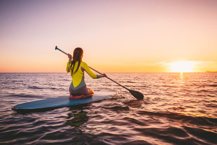 Paddle boarding in the ocean