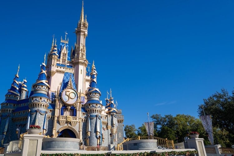 First time at Disney World - view of Cinderella's Castle with 50th anniversary plaque on it