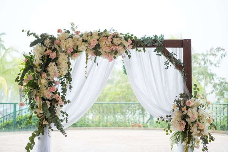 elopement ceremony arch with flowers
