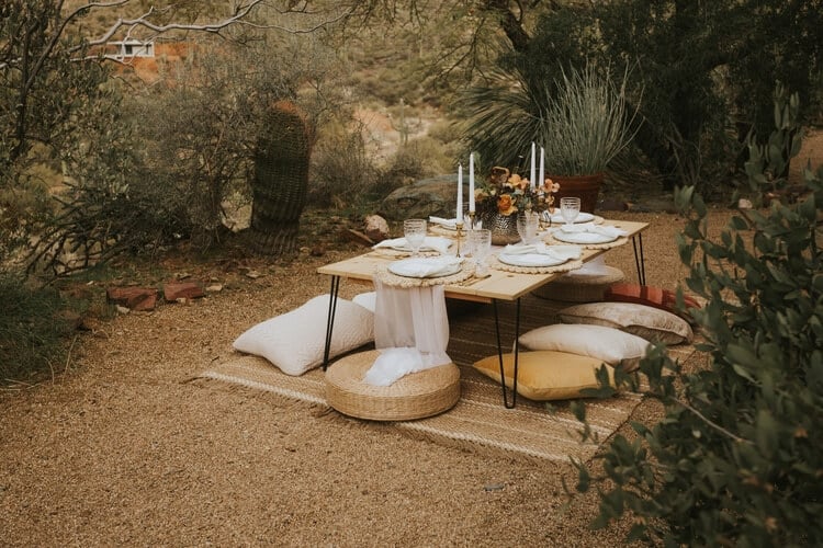 table in the countryside with cushions