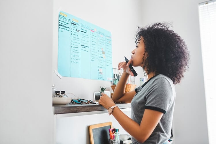 woman using a chart to plan