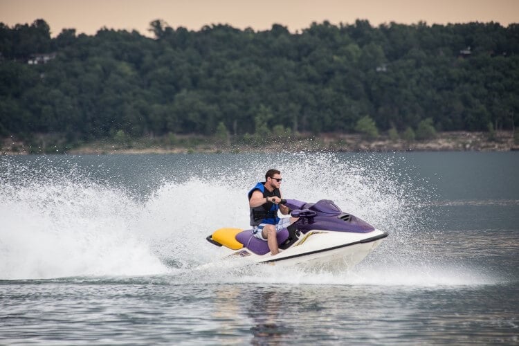 A man jet skiing on a lake