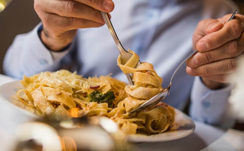 Man eating pasta