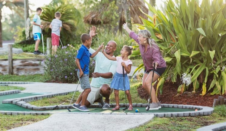 Family celebrating a hole-in-one. 