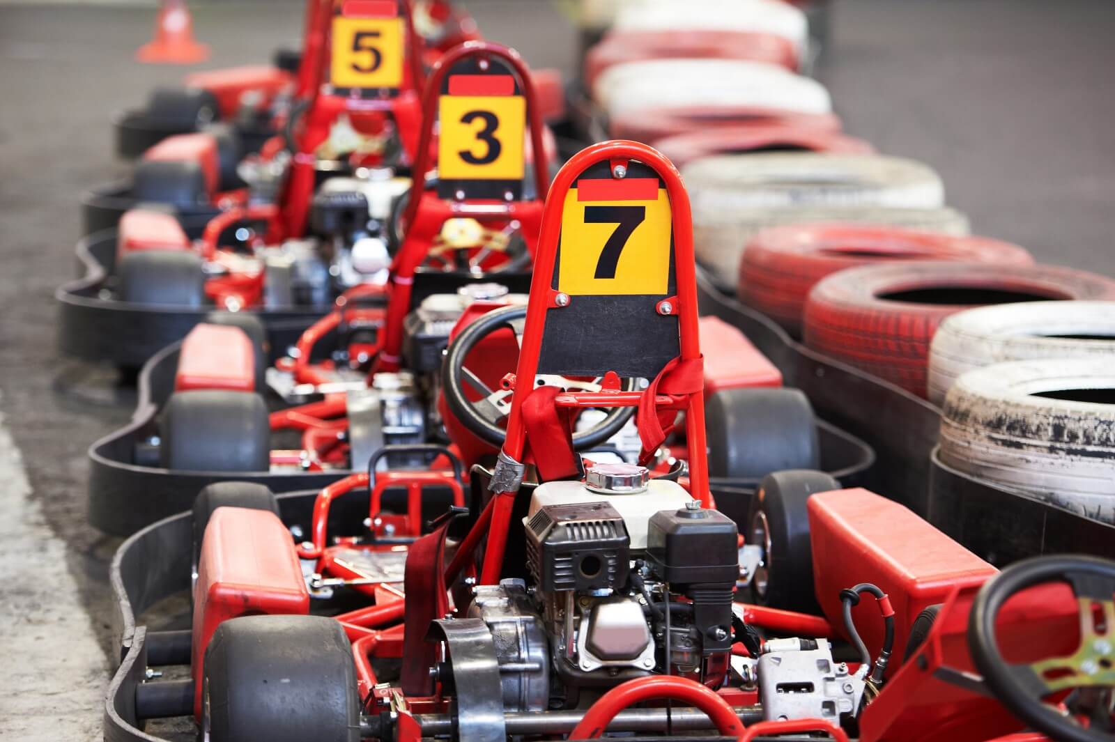 Red go karts in a line.