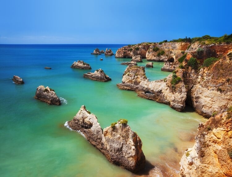 rock formations on a beach in the algarve