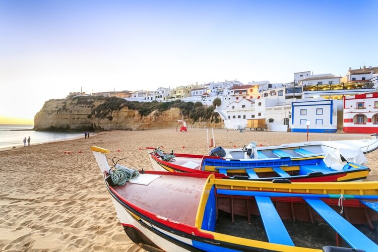 boats on a beach in the algarve