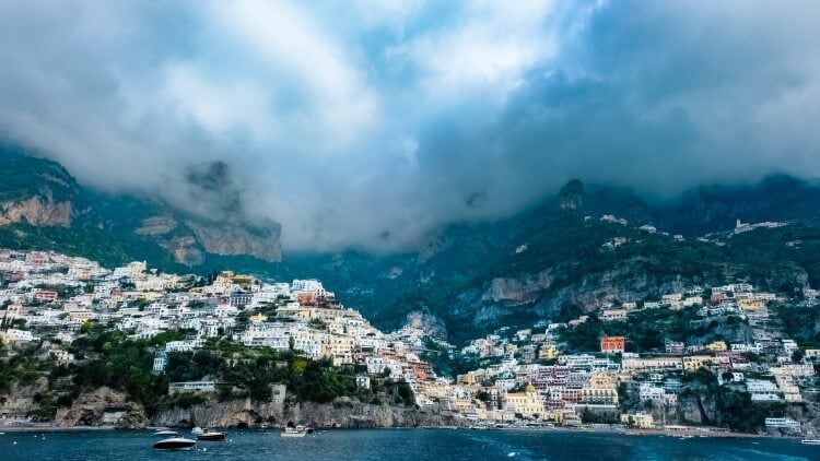 An Amalfi Coast hillside town with low cloud overhead