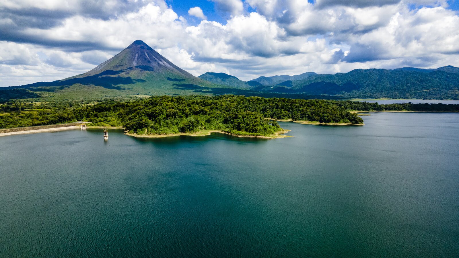 A panoramic image of Arenal volcano and the Costa Rica coastline