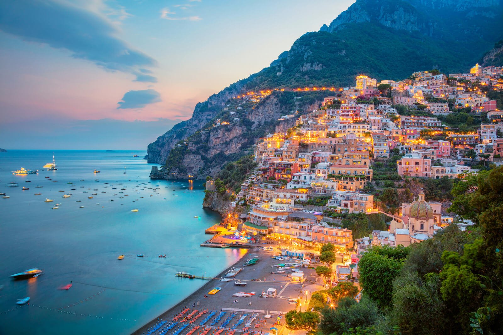 A sunset view of the town of Positano on the Amalfi Coast
