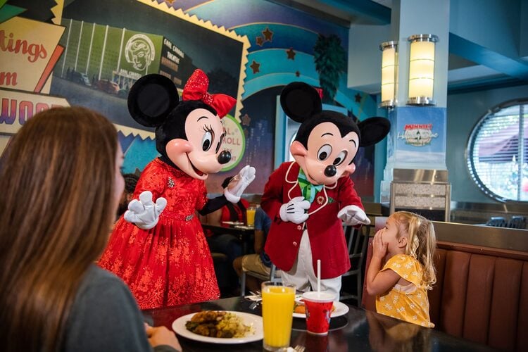Mickey and Minnie entertain young diners with a character dining experience at Hollywood and Vine restaurant