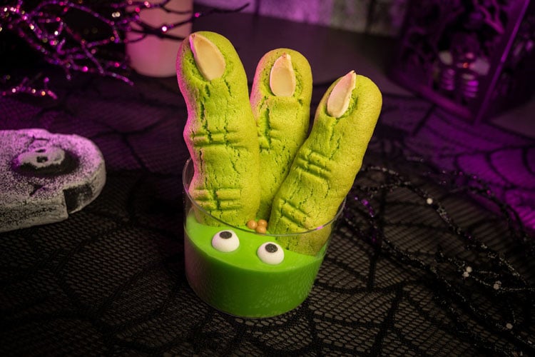 Green mousses dessert with sponge 'fingers' at the Disney World Halloween celebration event