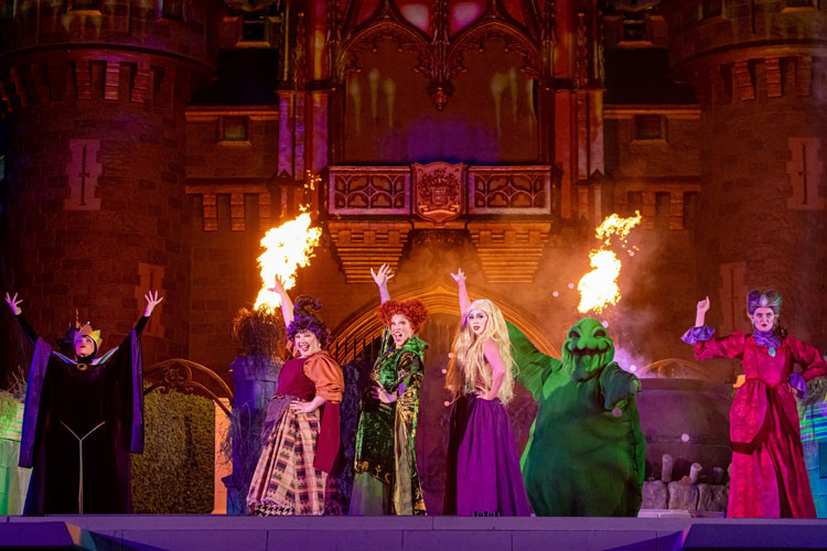 Performers dressed as the Sanderson Sisters and Oogie Boogie at the Disney World Halloween event