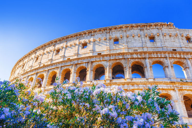 The Roman Colosseum with spring flowers - the best places to visit in April
