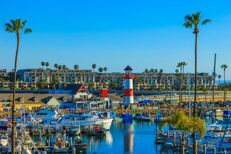Small harbor with red and white lighthouse in San Diego - the best places to visit in April