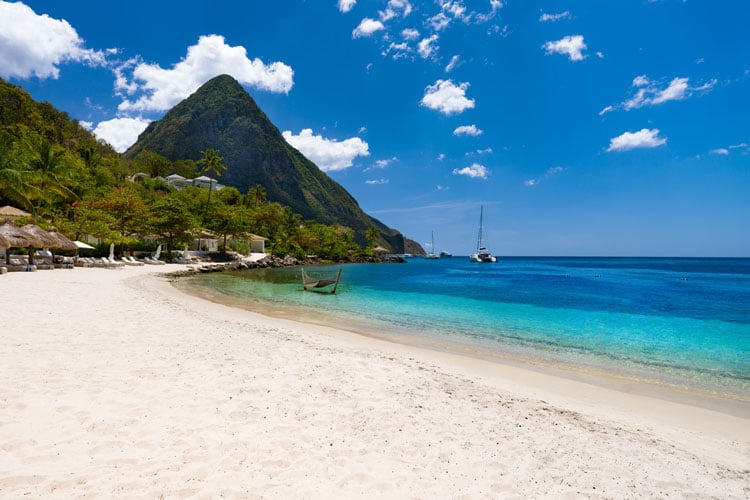 The best places to visit in December - white sand beach with Pitons view in St Lucia