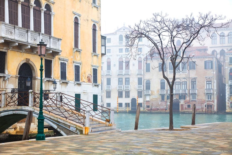 The best places to visit in December - Venice canals and building on a frosty morning