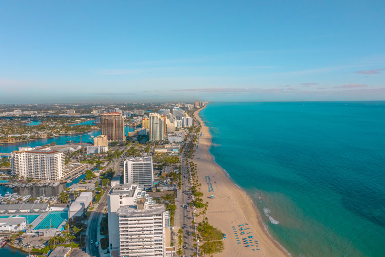 Aerial shot of Fort Lauderdale city and golden sand beach
