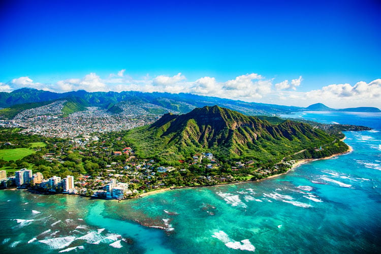 View of beautiful Hawaiian island with volcanic craters and seafront cities - a warm place to visit in January