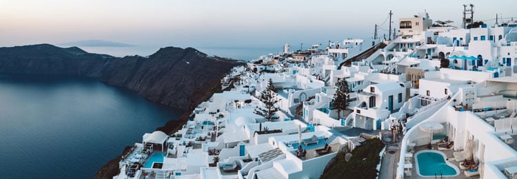 The best places to visit in November - hillside white painted village in Santorini
